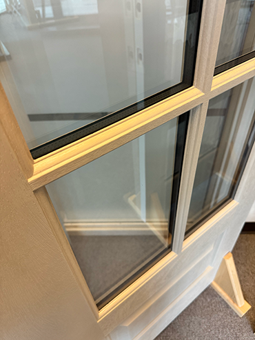 A photo of our door with molded SDL bars and Shadow Bars